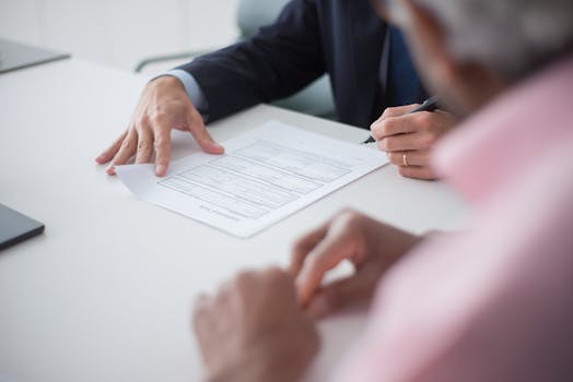 a satisfied client shaking hands with a financial advisor