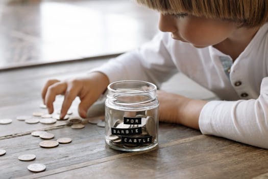 children saving coins in jars