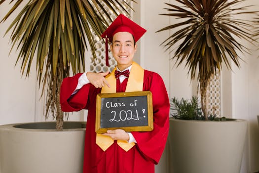 Image of a happy graduate holding a diploma