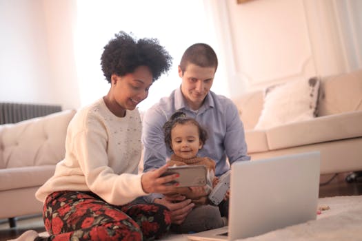 happy family in front of their new home